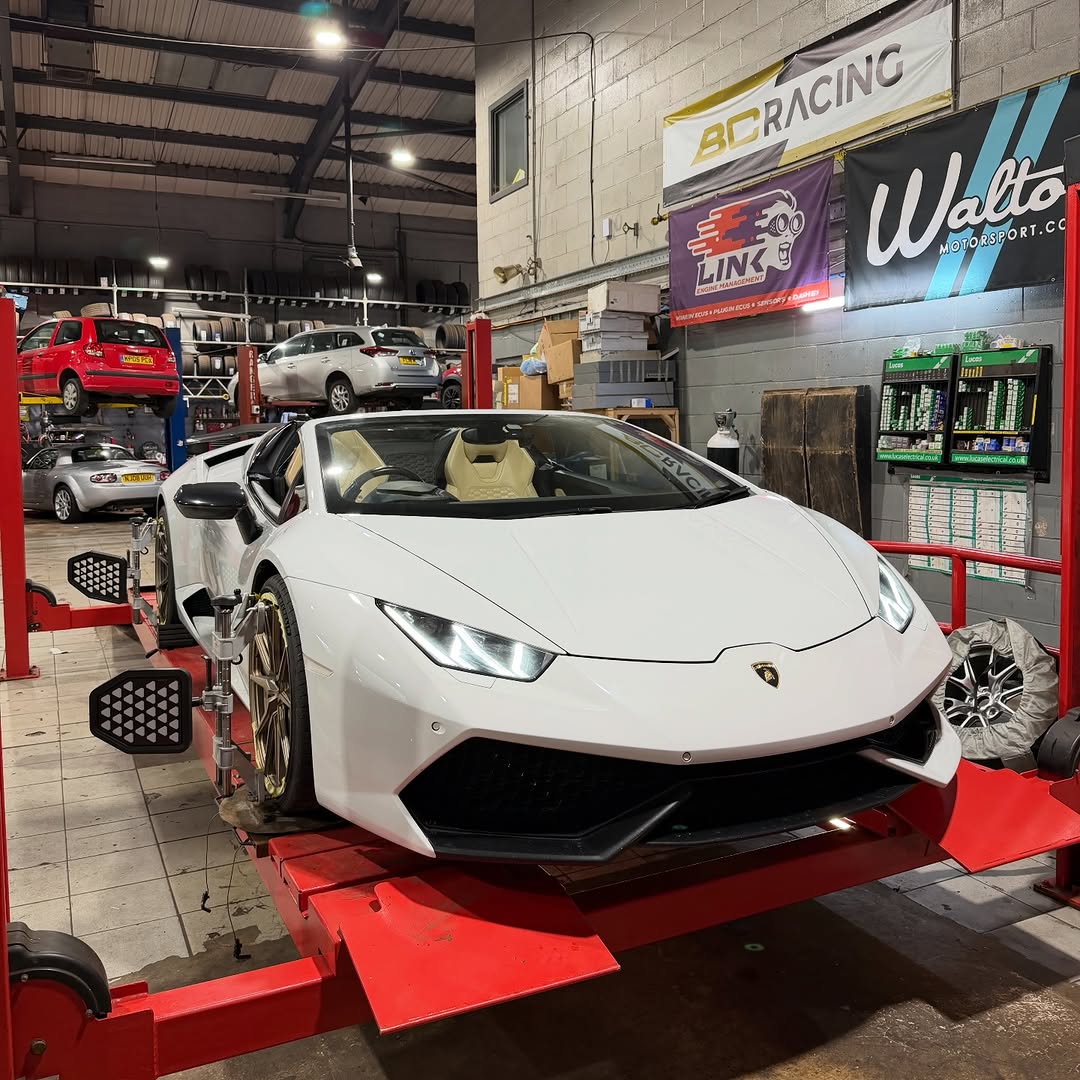 A white Lamborghini in the White Rose Motors workshop